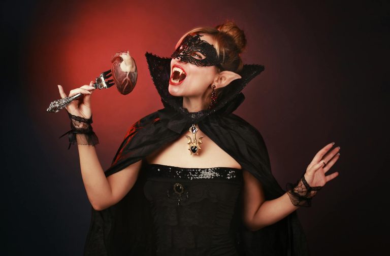 Woman in Black Dress Wearing Black Mask