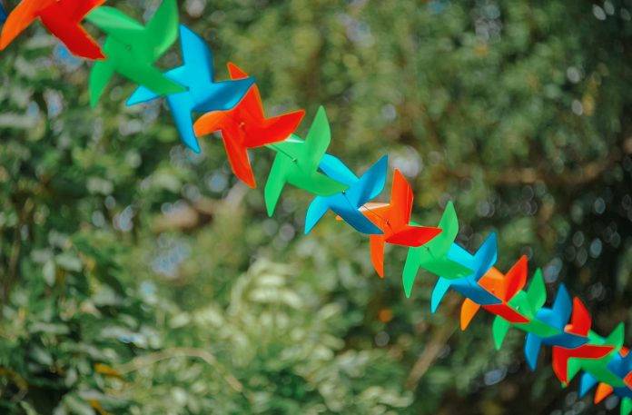 image-42 Selective Focus Photography of Pinwheels on String