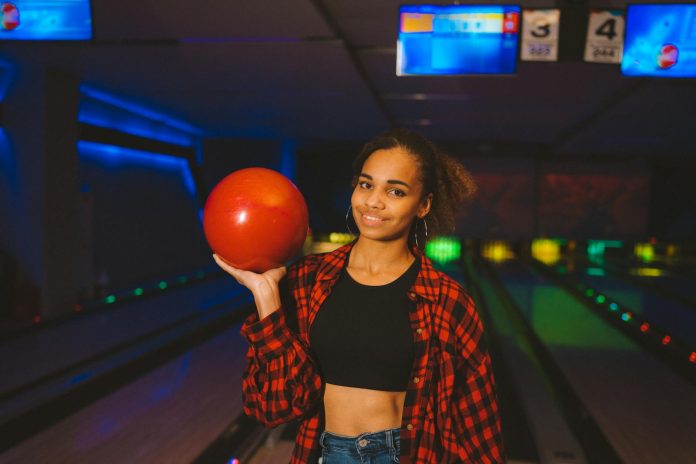 image-76 A Woman Holding a Bowling Ball
