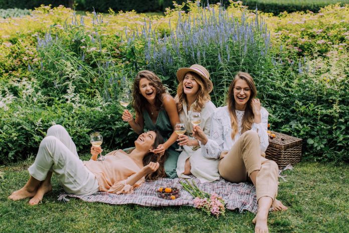 image-10 Women Sitting on Green Grass Field