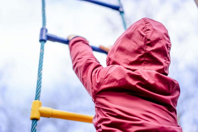 image-101 Kid climbing on ladder on playground
