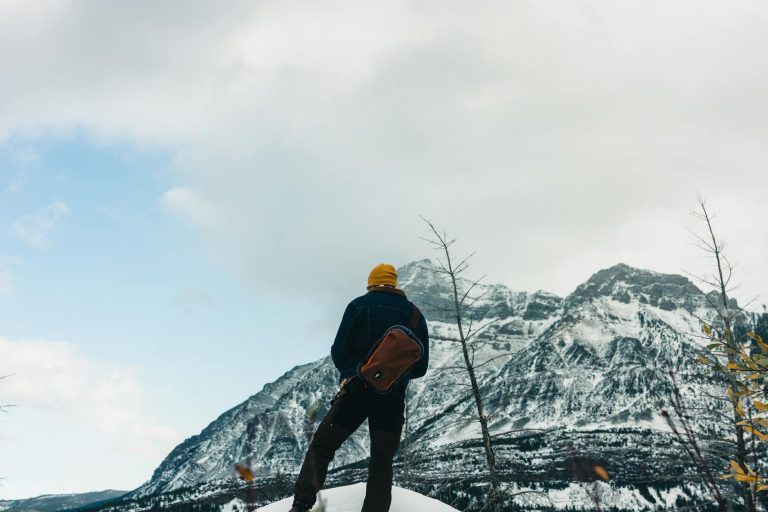 Back View of Man in Mountains in Winter