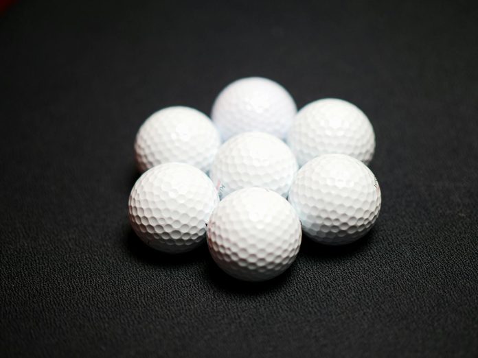 image-2 Set of golf balls on black background