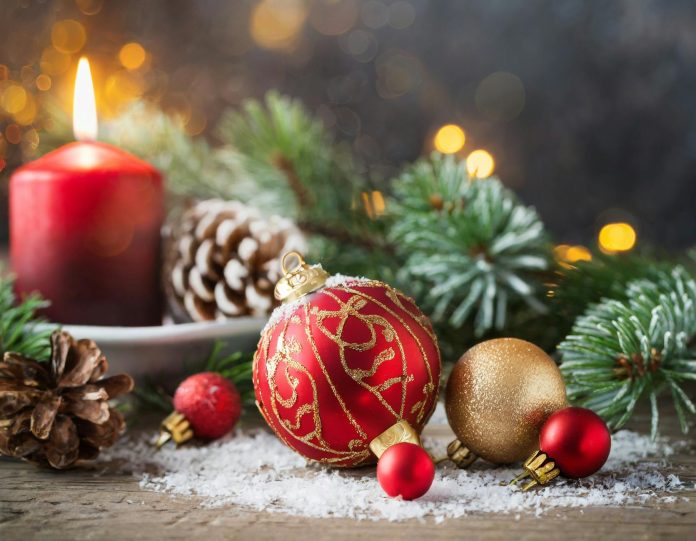 image-71 Christmas background with red balls, decorations and fir, selective focus on candle