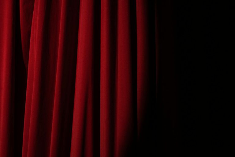 Spotlight on a Red Curtain