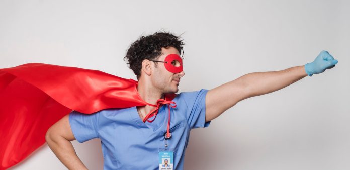 image-77 Brave doctor in flying superhero cape with fist stretched