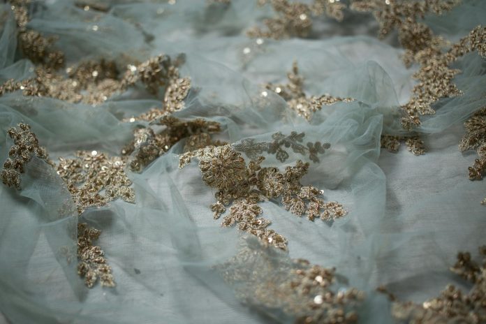 image-83 Lace Appliques On A White Sheer Fabric