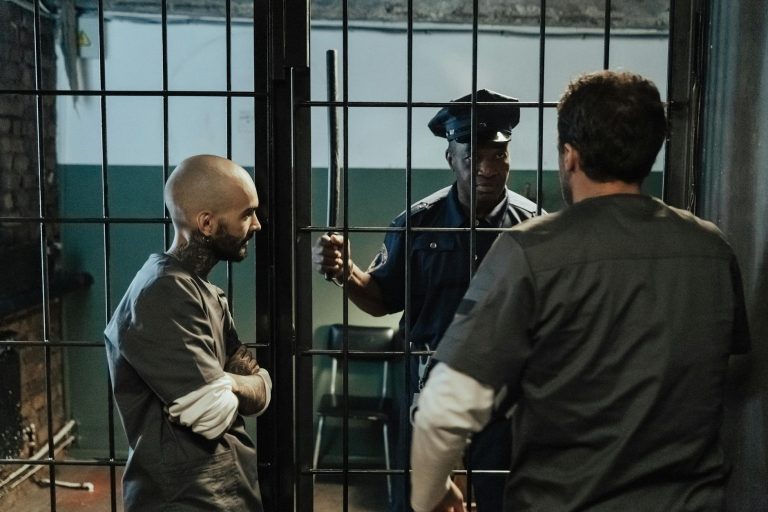 Policeman Talking with Prisoners